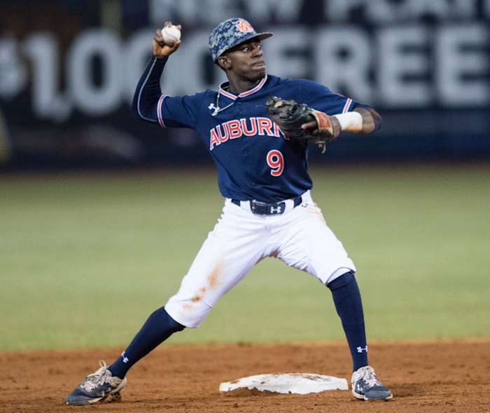 Auburn's Ryan Bliss (9) attempts a double play from second base during the Auburn-Alabama Capital City Classic at Riverfront Park in Montgomery, Ala., on Tuesday, March 26, 2019. Alabama defeated Auburn 6-3. Jc Aubase 23